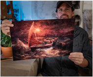 Artist Sean Diediker holds a fine art reproduction of his work Sherlock.