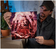Artist Sean Diediker holding a print reproduction of "The Stolen Generation" as shown on Canvasing The World Aboriginal culture of Blue Mountains Australia.