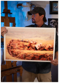 Artist Sean Diediker holding a fine art reproduction of his painting Rice Field Workers inspired by his travel to Bali Indonesia.