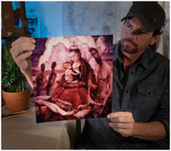 Artist Sean Diediker holding a print reproduction of "The Stolen Generation" as shown on Canvasing The World Aboriginal culture of Blue Mountains Australia.